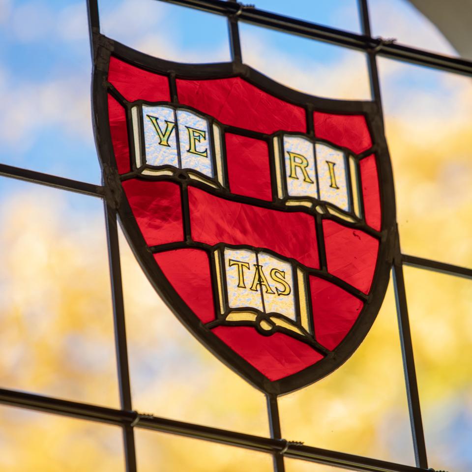 Harvard shield in stained glass at Swartz Hall